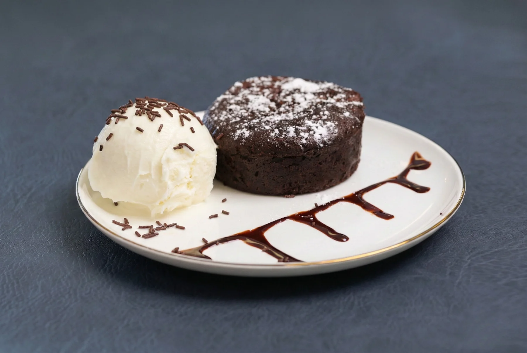 Molten Lava Cake: a warm chocolate lava cake with a scoop of vanilla ice cream